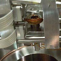 A view into the vacuum chamber where sodium atoms were cooled down to 500 picokelvin. The atoms where magnetically confined by the coil in the center which is 1 cm in diameter. The atoms were levitated 0.5 cm above the coil.
<P>
Photo courtesy Ketterle Lab