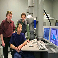 From left, Berkeley Lab scientists Nigel Browning, Alexander Ziegler (seated) and Robert Ritchie used this Scanning Transmission Electron Microscope to find new ways to toughen up advanced ceramics.
<P>
Courtesy Berkeley Lab