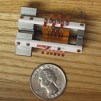 The ion trap where the main action takes place in the NIST aluminum ion clock. The aluminum ion and partner magnesium ion sit in the slit running down the center of the device between the electrodes. <br /><br />Credit: J. Koelemeij/NIST