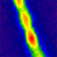 <p>
	This filament containing about 30 million carbon nanotubes absorbs energy from the sun as photons and then re-emits photons of lower energy, creating the fluorescence seen here. The red regions indicate highest energy intensity, and green and blue are lower intensity.</p>
<p>
	Image: Geraldine Paulus</p>
