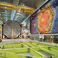 <P><SPAN class=caption id=photocaption>The groundbreaking for the cavern of the MINOS far detector, deep within Minnesota's Soudan iron mine, was on July 20, 1999. The excavation of the cavern took about two years, followed by the two-year construction of the detector. The University of Minnesota Foundation commissioned a mural for the MINOS cavern, painted onto the rock wall, 59 feet wide by 25 feet high. The mural contains images of scientists such as Enrico Fermi and Wolfgang Pauli, Wilson Hall at Fermilab, George Shultz, a key figure in the history of Minnesota mining, and some surprises.<BR><BR>Credit: <I>Fermilab</I></SPAN></P>