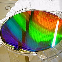 MIT’s Nanoruler was used to create parallel lines and spaces only 400 billionths of a meter apart (the diameter of a human hair is about 250 times larger) across this silicon wafer. The wafer is 12 inches in diameter.
<P>
Photo courtesy: Ralf Heilmann