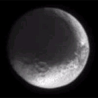 The moon with the split personality, Iapetus, presents a puzzling appearance. One hemisphere of the moon is very dark, while the other is very bright. Whether the moon is being coated by foreign material or being resurfaced by material from within is not yet known. 
<P>
Iapetus' diameter is about one third that of our own moon at 1,436 kilometers (892 miles). The latest image was taken in visible light with the Cassini spacecraft narrow angle camera on July 3, 2004, from a distance of 3 million kilometers (1.8 million miles) from Iapetus (pronounced eye-APP-eh-tuss). 
<P>
The brightness variations in this image are not due to shadowing, they are real. The face of Iapetus visible was observed at a Sun-Iapetus-spacecraft, or phase, angle of about 10 degrees. The image scale is 18 kilometers (11 miles) per pixel. The image was magnified by a factor of two to aid visibility. 
<P>
The Cassini-Huygens mission is a cooperative project of NASA, the European Space Agency and the Italian Space Agency. The Jet Propulsion Laboratory, a division of the California Institute of Technology in Pasadena, manages the Cassini-Huygens mission for NASA's Office of Space Science, Washington, D.C. The Cassini orbiter and its two onboard cameras were designed, developed and assembled at JPL. The imaging team is based at the Space Science Institute, Boulder, Colo. 
<P>
For more information, about the Cassini-Huygens mission visit, <A HREF='http://saturn.jpl.nasa.go' TARGET='_blank'>http://saturn.jpl.nasa.go</A>v and the Cassini imaging team home page, <A HREF='http://ciclops.or' TARGET='_blank'>http://ciclops.or</A>g. 
<P>
Credit: NASA/JPL/Space Science Institute