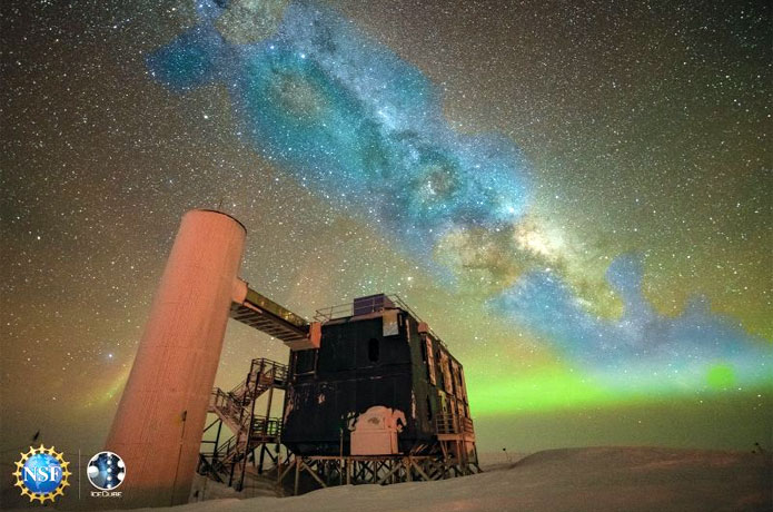 <p>An artist's composite image of a photo of the above-ground portion of the IceCube Neutrino Observatory along with the first-ever neutrino-based image of the Milky Way. The detected neutrinos, depicted in blue, are shown positioned in their approximate location relative to the more familiar optical view of the Milky Way galaxy.<br />
Credit: IceCube Collaboration (Yuya Makino)/U.S. National Science Foundation</p>
